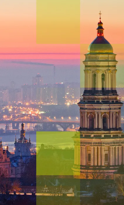 Kyiv city skyline with golden domes and bell tower at sunset, representing Hogan Lovells’ work advising the Government of Ukraine in a landmark mineral rights agreement with the U.S..