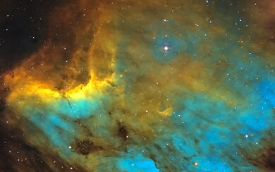Stars and gaseous formations of yellow and blue in outer space