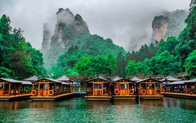 Baofeng Lake Boat Trip in a rainy day with clouds and mist at Wulingyuan, Zhangjiajie National Forest Park
