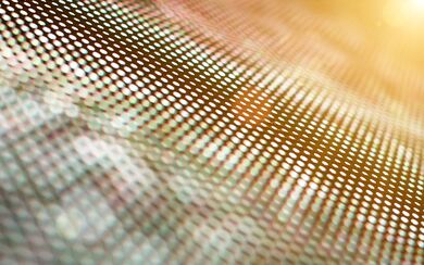 Digital LED screen with orange and green hues