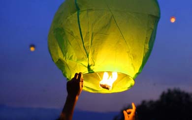 A green, floating paper lantern.