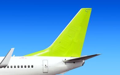 A modern passenger jet aircraft image showcasing the impact of technological advancements on the automotive and mobility sectors.